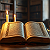 Post: The images depict a series of open books, each illuminated by flickering candlelight in dimly lit...